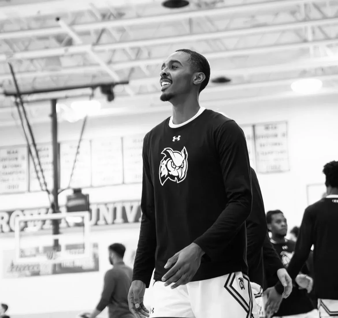 Black-and-white image of Fareed Burton Jr. in a black long-sleeve warmup